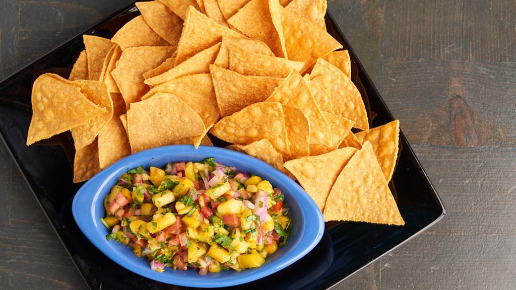 Mango Salsa & Chips · Diced mangos, red onions, jalapeños, cilantro, tomatoes and garlic. Tossed with lime juice. Served with a side of chips.