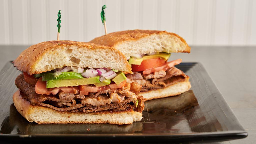 Torta · Carne Asada, Mayo, Avocado, Tomato and Onions . All Sandwiched In a Toasted Bolillos Roll.