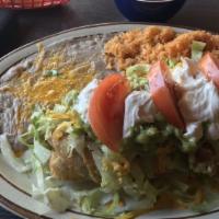 Chimichanga · Flour tortilla stuffed with pork, beef, or chicken, deep fried to golden brown and topped wi...