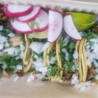 Taco plate beef · 4 tacos with cilantro, onions, 
Radishes ,limes ,