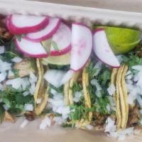 Taco plate carnitas · 4 tacos with cilantro and onions,
Radishes ,limes