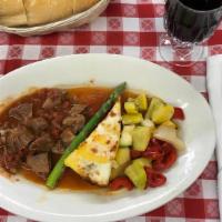 Nonni's Italian Pot Roast · Slices of Savory Pot Roast, Covered in Nonni’s Delicious Italian “Gravy”, Served with Zucchi...