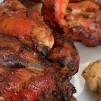 Tandoori Chicken · Chicken marinated in home made yogurt, spices and roasted in clay oven. 6 pieces served with...