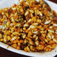 Bhel Puri · Rice puffs tossed potatoes, onions, spices and chutneys.