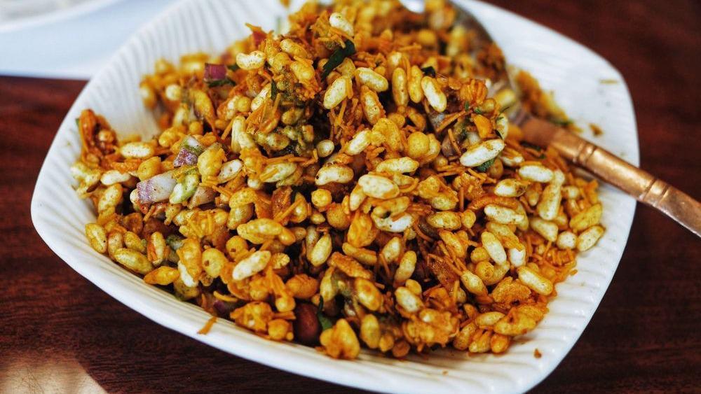 Bhel Puri · Rice puffs tossed potatoes, onions, spices and chutneys.