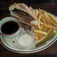French Dip · Roast Beef with Au Jus & Horseradish (On The Side) on a French roll. Served with Pickle Spea...