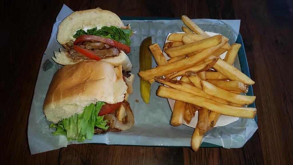 Steak Sandwich · New York Strip, Lettuce, Tomato, Grilled Onions and Mayo on a French roll.   Served with Pickle Spear (On Side) and Fries or Salad.