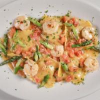 Seafood Ravioli · seafood-filled fresh pasta, roma tomatoes, asparagus, lemon butter, shrimp