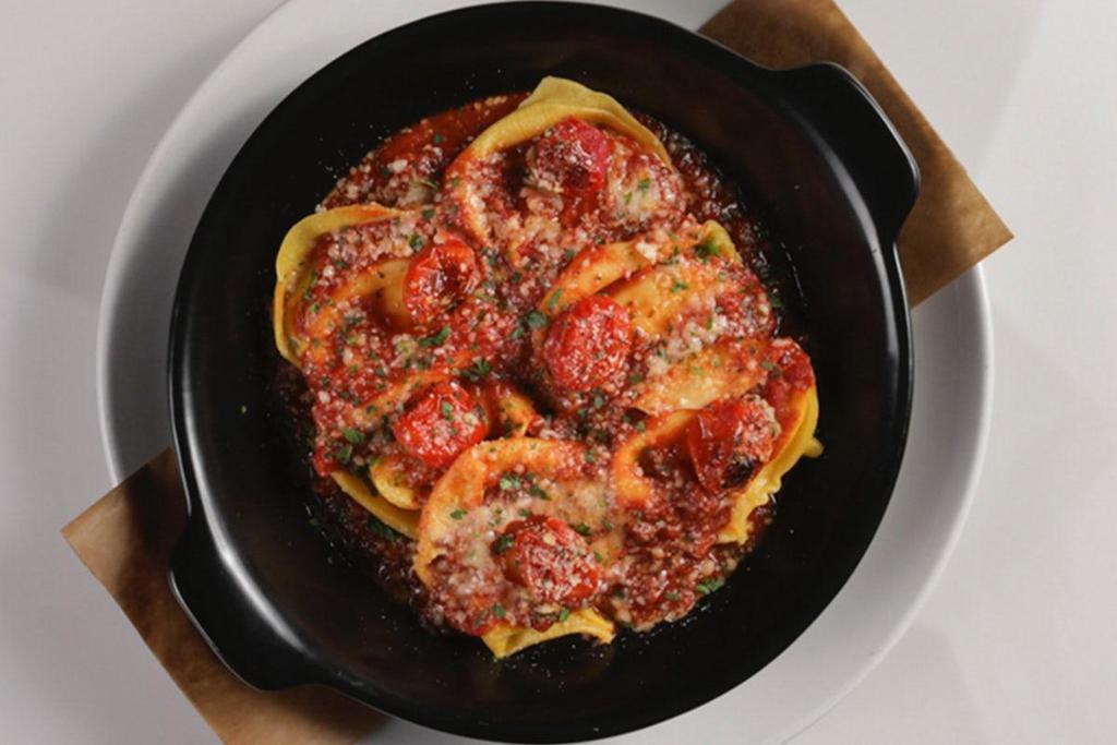 Pomodoro Tortellacci · tortellacci stuffed with four-cheese blend, imported pomodorina, charred tomato