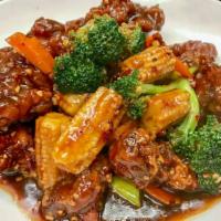 General Tso's Chicken · Spicy Deep Fried Chicken with Broccoli & Carrots Glazed in Sweet & Spicy Sauce.