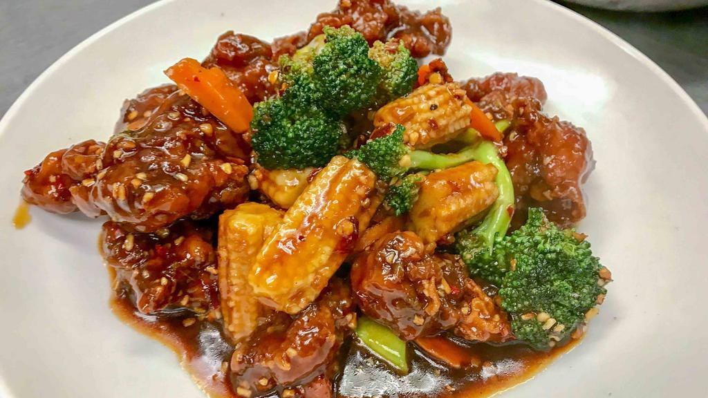 General Tao'S Chicken 左宗鸡  · Spicy. Breaded chicken stir-fried in a spicy Chinese sauce with carrots, baby corn, and broccoli.