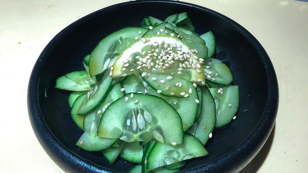 Sunomono · Sliced cucumber in vinegar dressing.