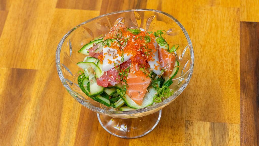 Seafood Sunomono · Chef choice sashimi with sliced cucumber in vinegar dressing.