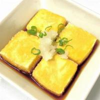 Agedashi Tofu · Fried tofu served in tempura broth with bonito flakes.