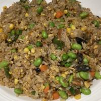 Unagi Fried Rice · Fried with egg, peas and carrots.