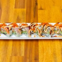 Giant · Soft shell crab, avocado, cucumber roll with assorted fish, unagi, tobiko, noma sauce.