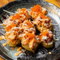 Fat Boy Mix · Deep fried California roll topped with assorted fish, scallop, crab, tobiko, noma sauce.