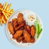 Classic Cluck Wings · Fresh chicken wings breaded and fried until golden brown.