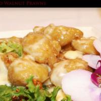 Honey Roasted Walnut Prawns · Selected gulf prawns lightly deep fried and smothered in a creamy white sauce, topped with c...
