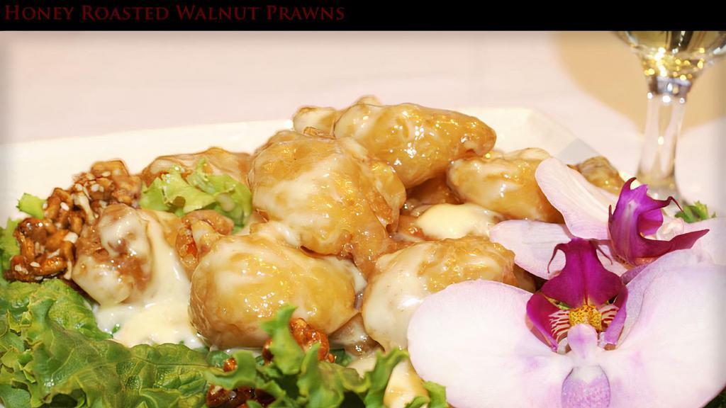 Honey Roasted Walnut Prawns · Selected gulf prawns lightly deep fried and smothered in a creamy white sauce, topped with crispy walnuts.