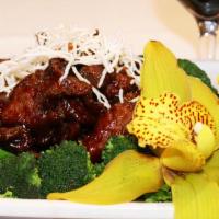 Chef Li's Beef · Tender sliced beef sauteed with plum sauce and onions, topped with crispy noodle.