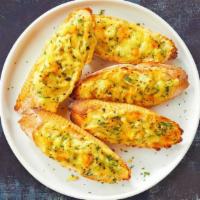 Melty Way Garlic Bread · Housemade bread toasted and garnished with butter, garlic, mozzarella cheese, and parsley.