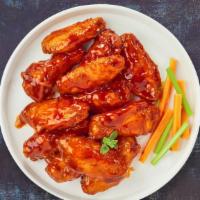 Hot Chick Wings · Fresh chicken wings breaded and fried until golden brown and tossed in hot sauce. Served wit...