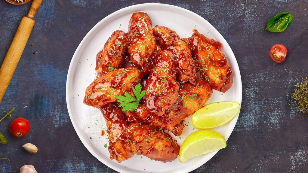 Cajun Craving Wings · Fresh chicken wings breaded and fried until golden brown and tossed in cajun sauce. Served with a side of ranch or bleu cheese.