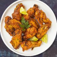 Lemon Pepper Wings · Fresh chicken wings breaded and fried until golden brown and tossed in lemon pepper sauce. S...