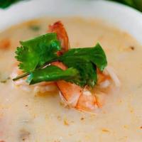 Coconut Soup (Tom Kah). · With galangal, lemongrass, kaffir leaves, mushroom, tomato & cilantro.