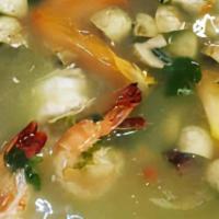 Seafood Soup (Poe Thak Talay) · Spicy seafood soup with prawn, basa fish, scallop, calamari & mussel flavored with lemongras...