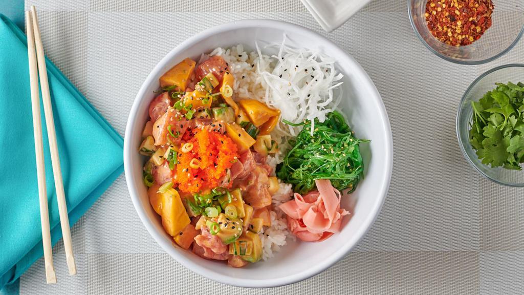 Mango Poke Bowl · Diced salmon, tuna, avocado, and mango over sushi rice and topped with fish roe.