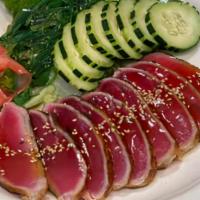 Ahi Tuna Tataki Salad · Seared Ahi tuna with seaweed and cucumber.