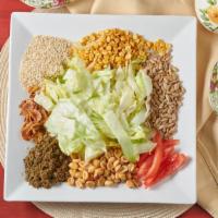 Tea Leaf Salad · Salad prepared with imported Burmese tea leaves, tomatoes, lettuce, fried garlic, fried onio...