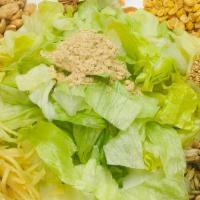 Ginger Salad · Salad prepared with shredded ginger, fried garlic, sesame seeds, lettuce, peanuts and fried ...