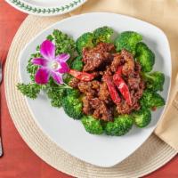 Orange Beef · Hot and spicy. Sliced beef deep-fried until crispy and the stir-fried with orange peel in sw...