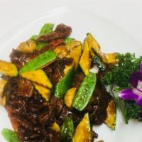 Beef with Oyster Sauce · Sliced beef sautéed with zucchini and snow peas in oyster sauce.