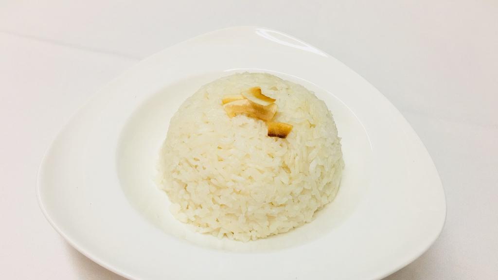Coconut Rice (Per Person) · Jasmine rice cooked with coconut milk.