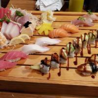 Queen's Sushi Boat · 16 pieces sashimi, 10 pieces nigiri, 1 any special roll.