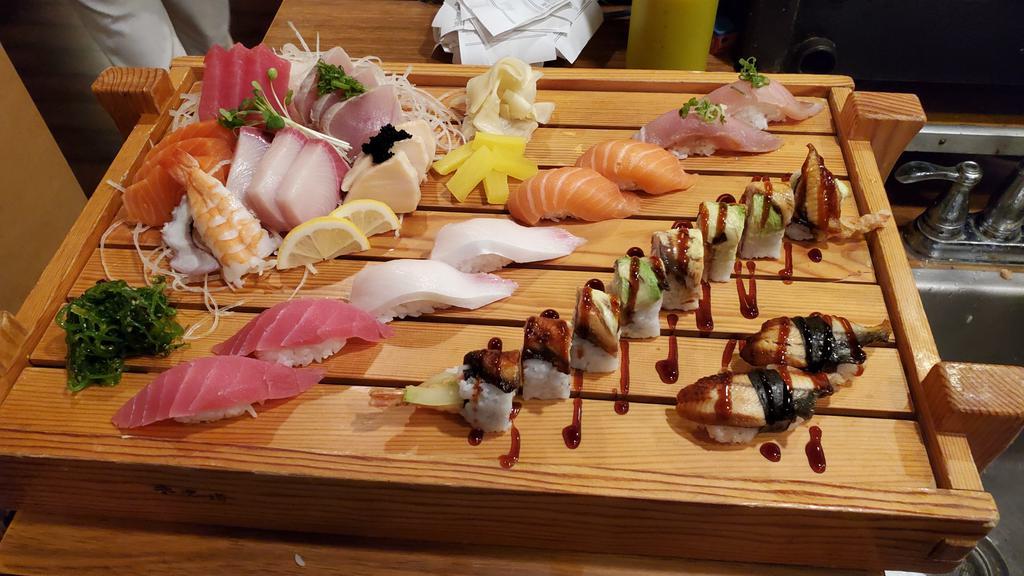Queen's Sushi Boat · 16 pieces sashimi, 10 pieces nigiri, 1 any special roll.