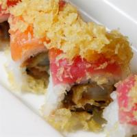 7. Big Smile Roll · Shrimp tempura, spicy tuna, and cucumber topped with tuna, salmon, and crunch.