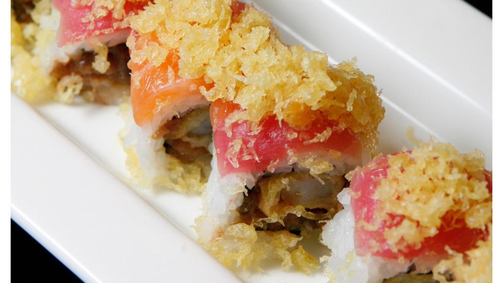 7. Big Smile Roll · Shrimp tempura, spicy tuna, and cucumber topped with tuna, salmon, and crunch.