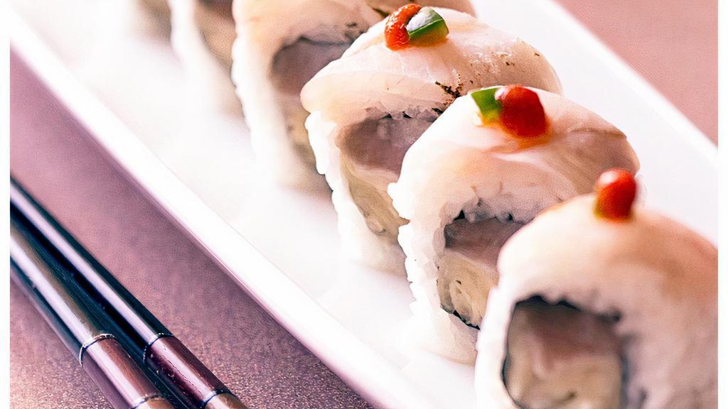 6. White Tuna Tataki Roll · Spicy tuna roll topped with sea red albacore and ponzu sauce and garlic.