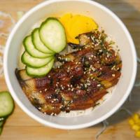 Unagi Don · Eel, Japanese pickle radish, and seaweed salad over steam white rice, topped with roast sesa...