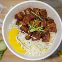 Pork belly  rice  · Stewed pork and house make  soy with rice, green onions and pickle radish.