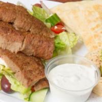 Gyros Platter · Gyros meat with hummus, tzatziki and a small greek salad.