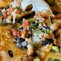 Mr. Mojito Nachos · Spicy salsa, black beans, cheese, pico, sour cream, jalapenos. Add steak and chicken for an ...