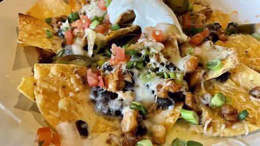 Mr. Mojito Nachos · Spicy salsa, black beans, cheese, pico, sour cream, jalapenos. Add steak and chicken for an additional cost.