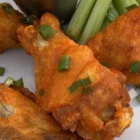 Wings · (buffalo, asian zing, buffalo) served with celery & topped with green onions.
