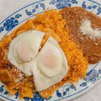 Chilaquiles · Fried tortilla pieces sautéed in your choice of sauce with your choice style eggs (two) acco...